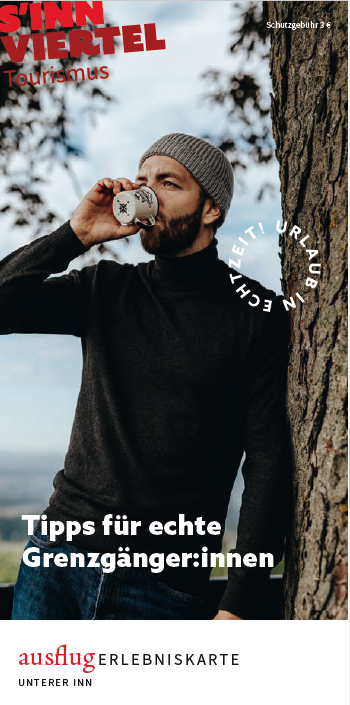 Cover der Ausflugskarte Unterer Inn - Winter mit einem jungen Mann, der aus einer Tasse trinkt.